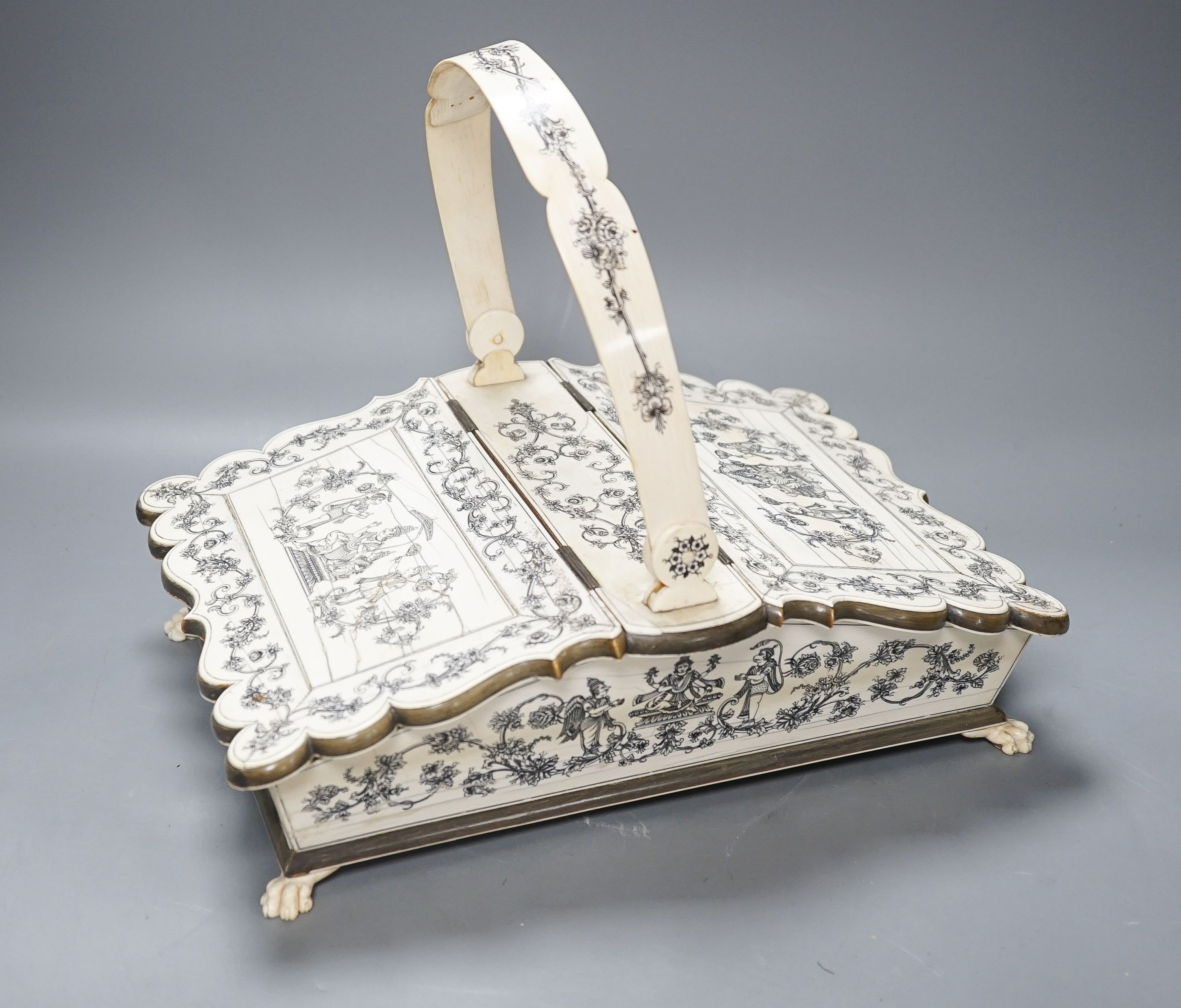 A 19th century Vizagatapatam Ivory and horn swing basket 32cm